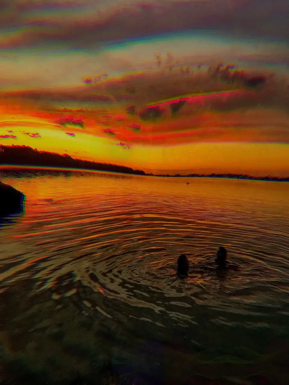 sunset swimming in a licorice ocean