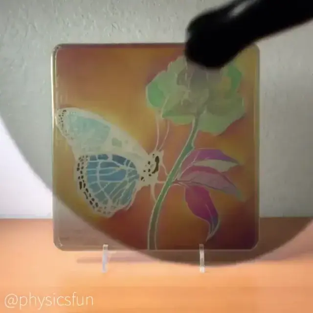 Real art piece with polarized light that looks an awful lot like psychedelic color shifting (x-post r/woahdude)