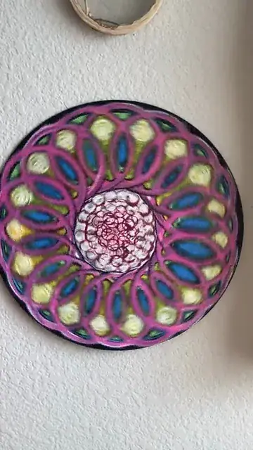 painted on a recycled record to capture some closed eye visuals